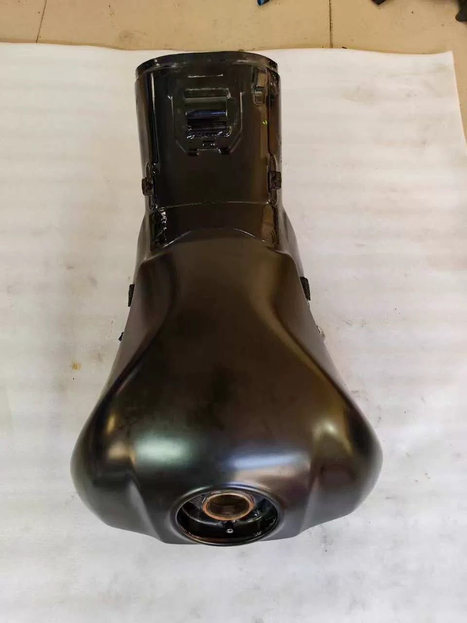 Top-down view of black Kawasaki ZX10R fuel tank, full teardrop body with fuel pump opening at base, no dents
