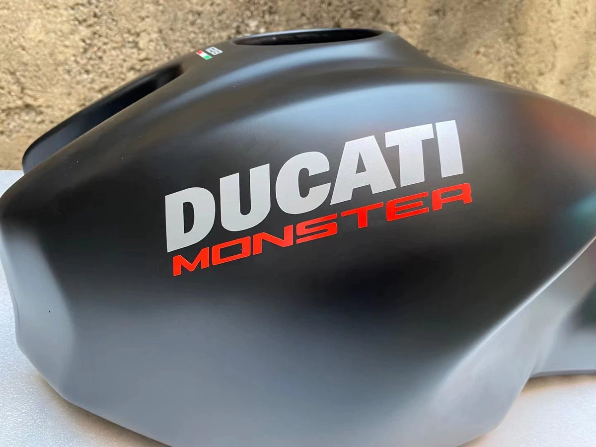 Ducati Monster 821 OEM fuel tank repainted red, front three-quarter angle view showing smooth finish