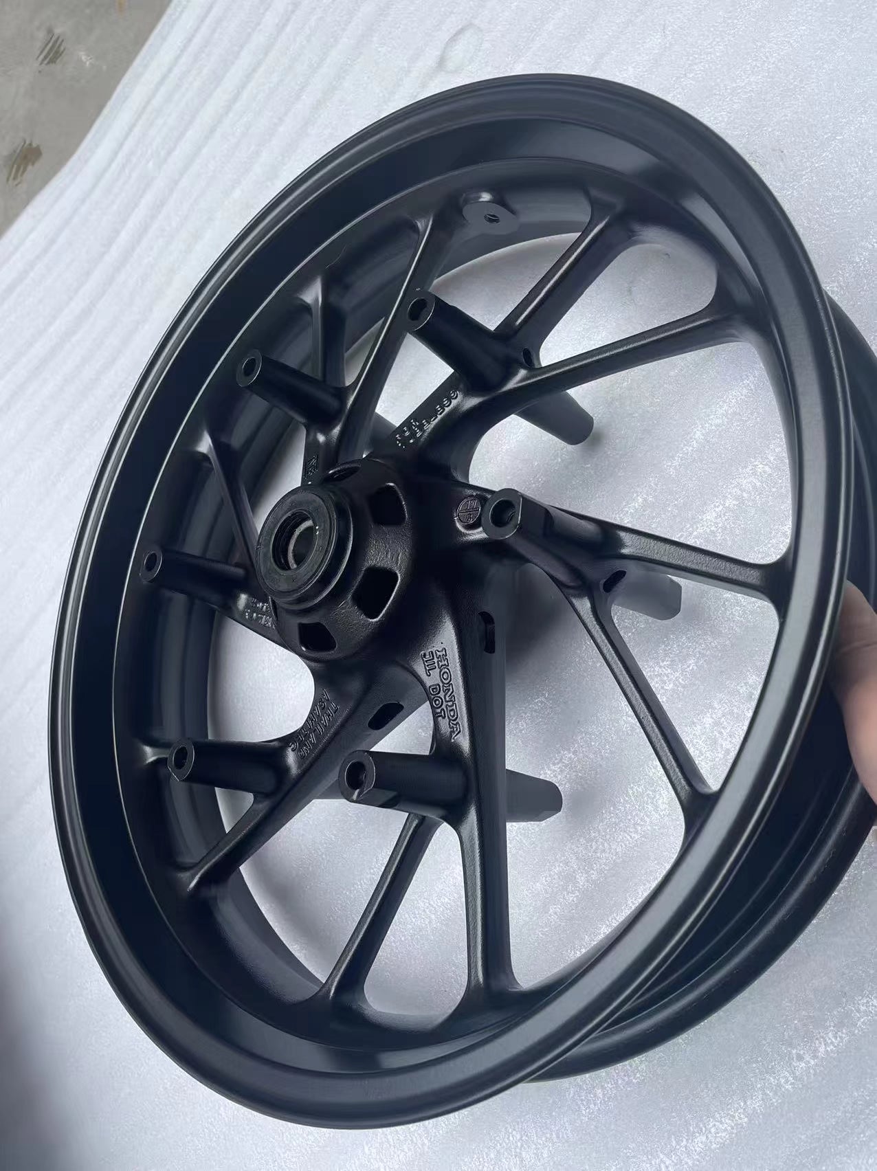 Honda CBR650F front wheel repaint matte black straight true condition detail