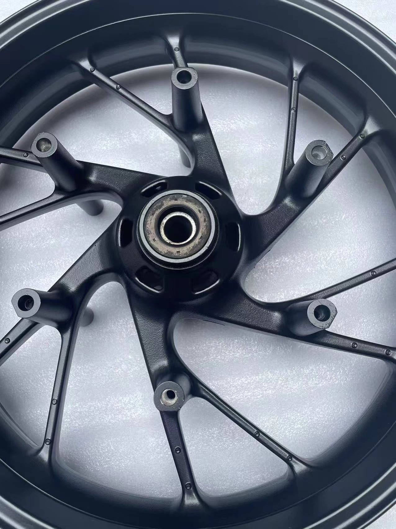 Honda CB650F 17x3.5 front wheel ten-spoke rim matte black detail
