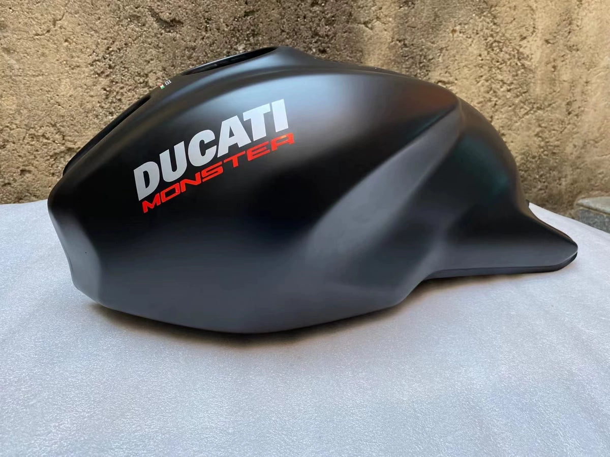 Ducati Monster 821 OEM fuel tank repainted red, top-down view showing cap area and surface condition