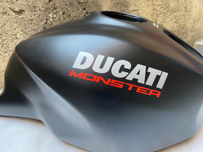 Ducati Monster 821 OEM fuel tank repainted red, rear angle showing tank contour and mounting points