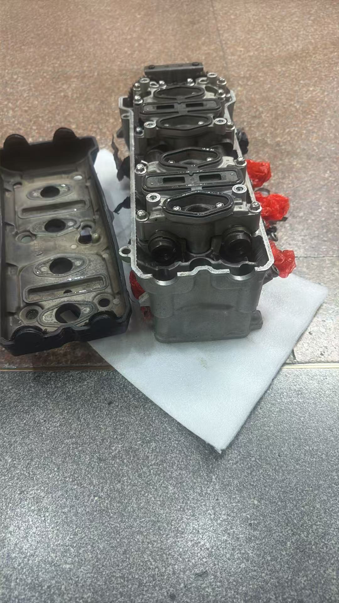 GSX-R600 cylinder head underside combustion chambers and valve seats close-up inspection view