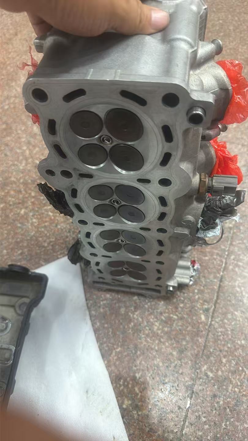 Suzuki GSX-R600 cylinder head bottom view showing combustion chambers and valve seats condition