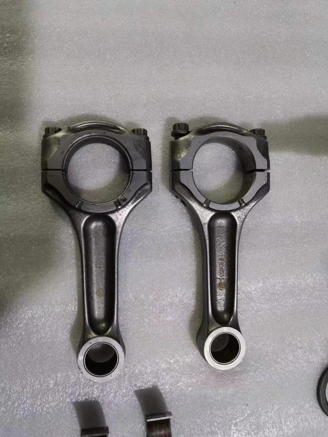 Ducati 848 crankshaft close-up side angle showing journal surfaces and counterweights, used condition