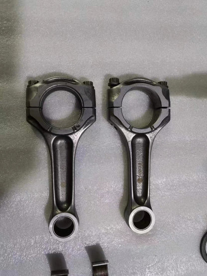 Ducati 848 crankshaft close-up side angle showing journal surfaces and counterweights, used condition