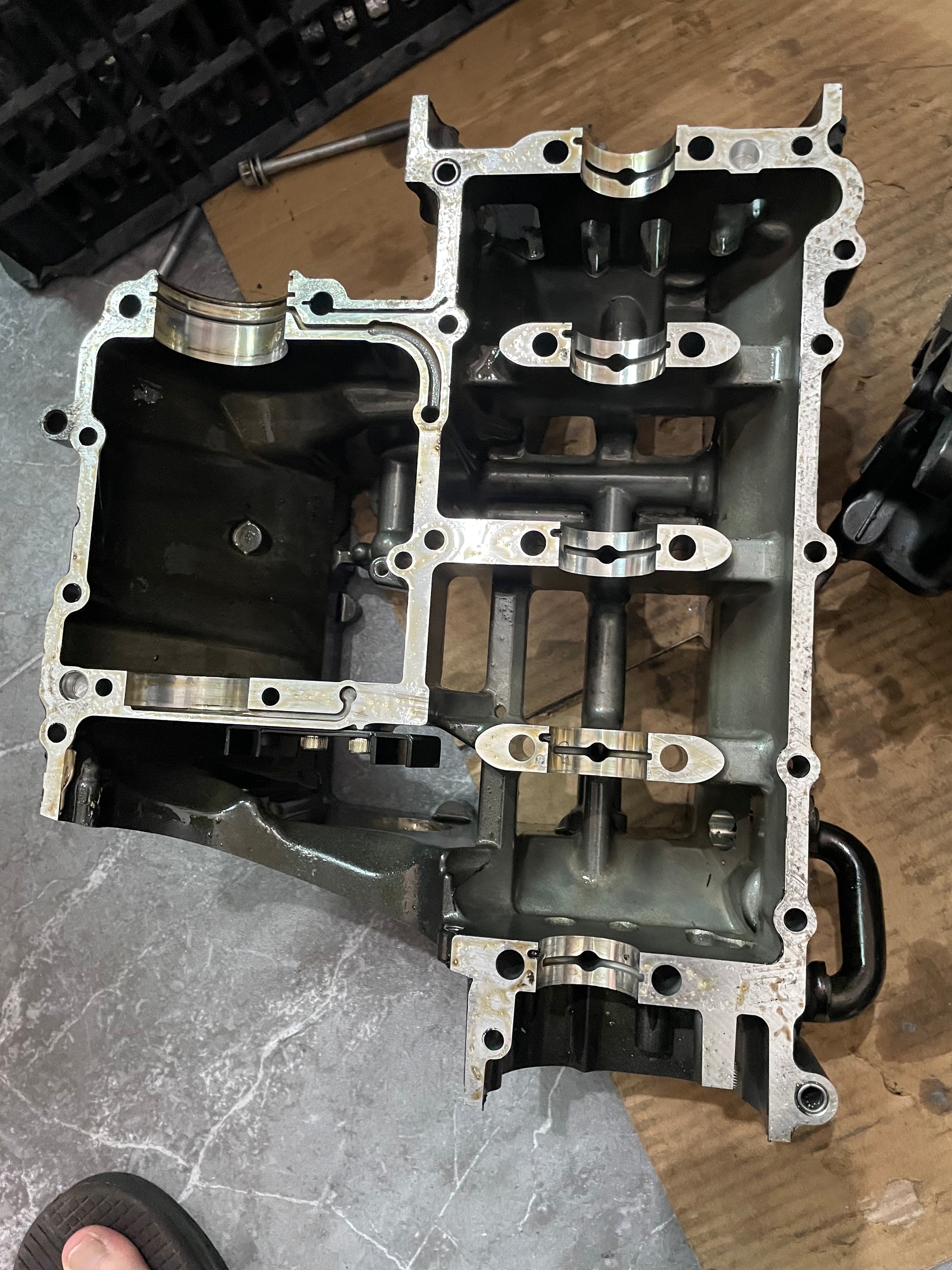 Full lower crankcase half of YZF-R6, mating face up showing bearing saddles and oil passages
